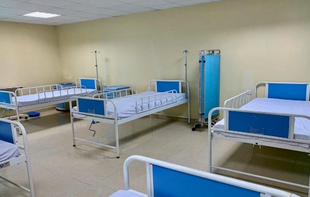 A clean hospital ward with blue beds